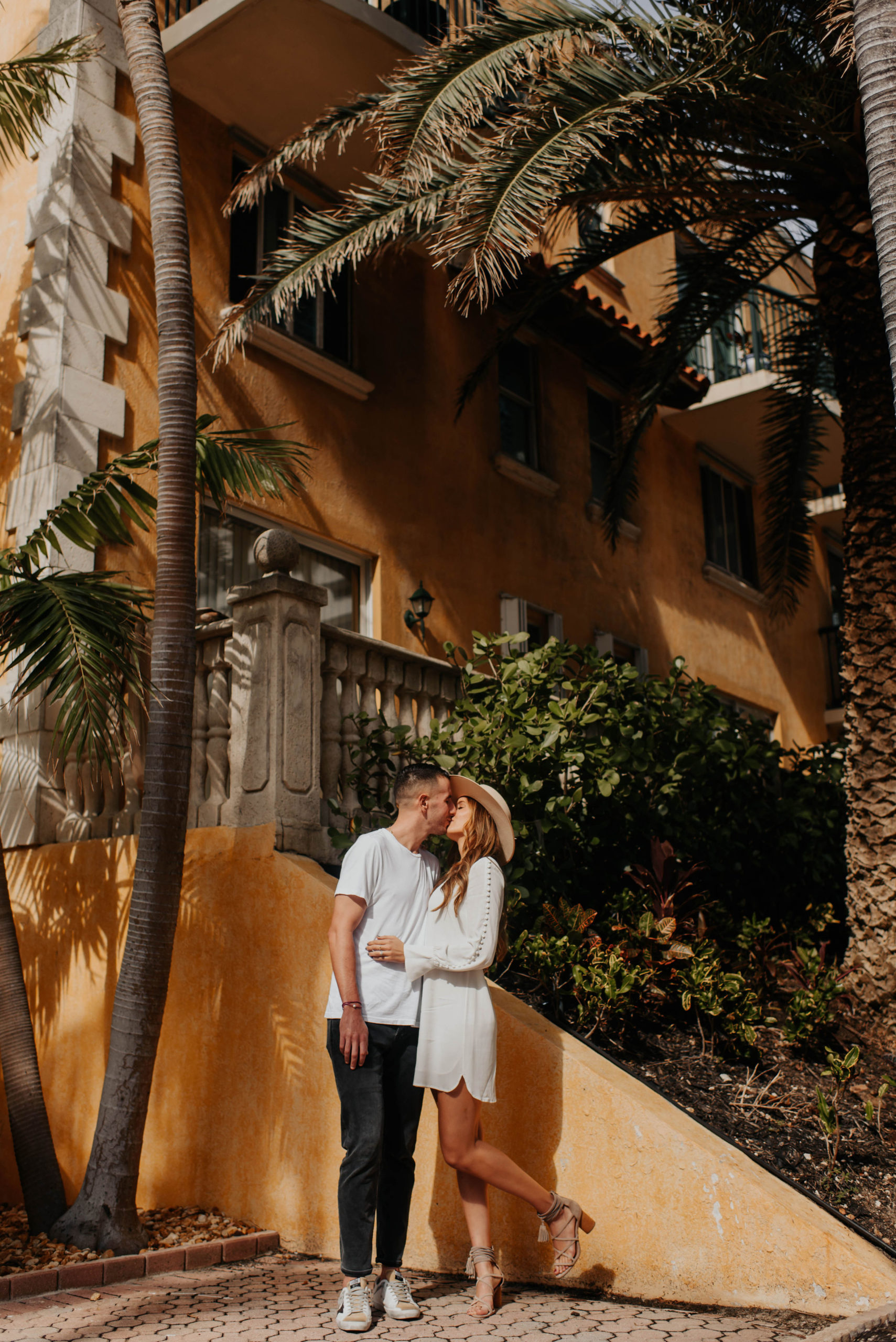 couple in front of palm tree in miami florida